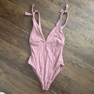 One piece tie strap bathing suit